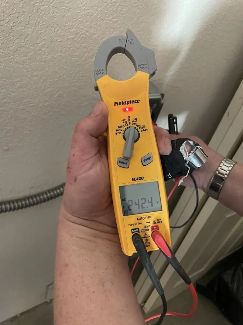 Voltage testing with clamp meter during Ceiling Fan Installation in Zillah